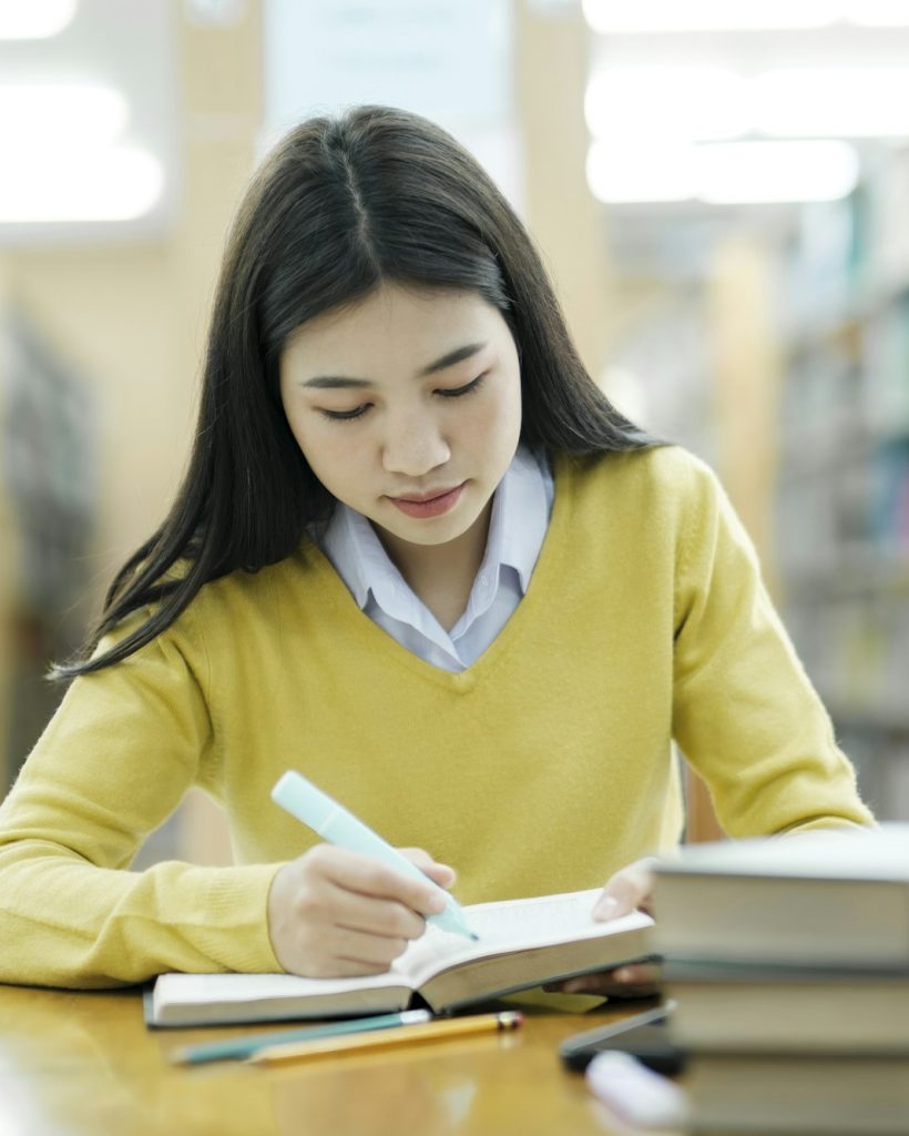 Student studying at library.